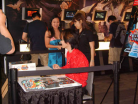U1 signing autographs at E for All