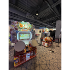 Two Taiko no Tatsujin machines w/ left machine active, right machine out of service