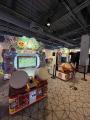 Two Taiko no Tatsujin machines w/ left machine active, right machine out of service